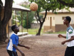 medium-shot-kids-playing-with-ball